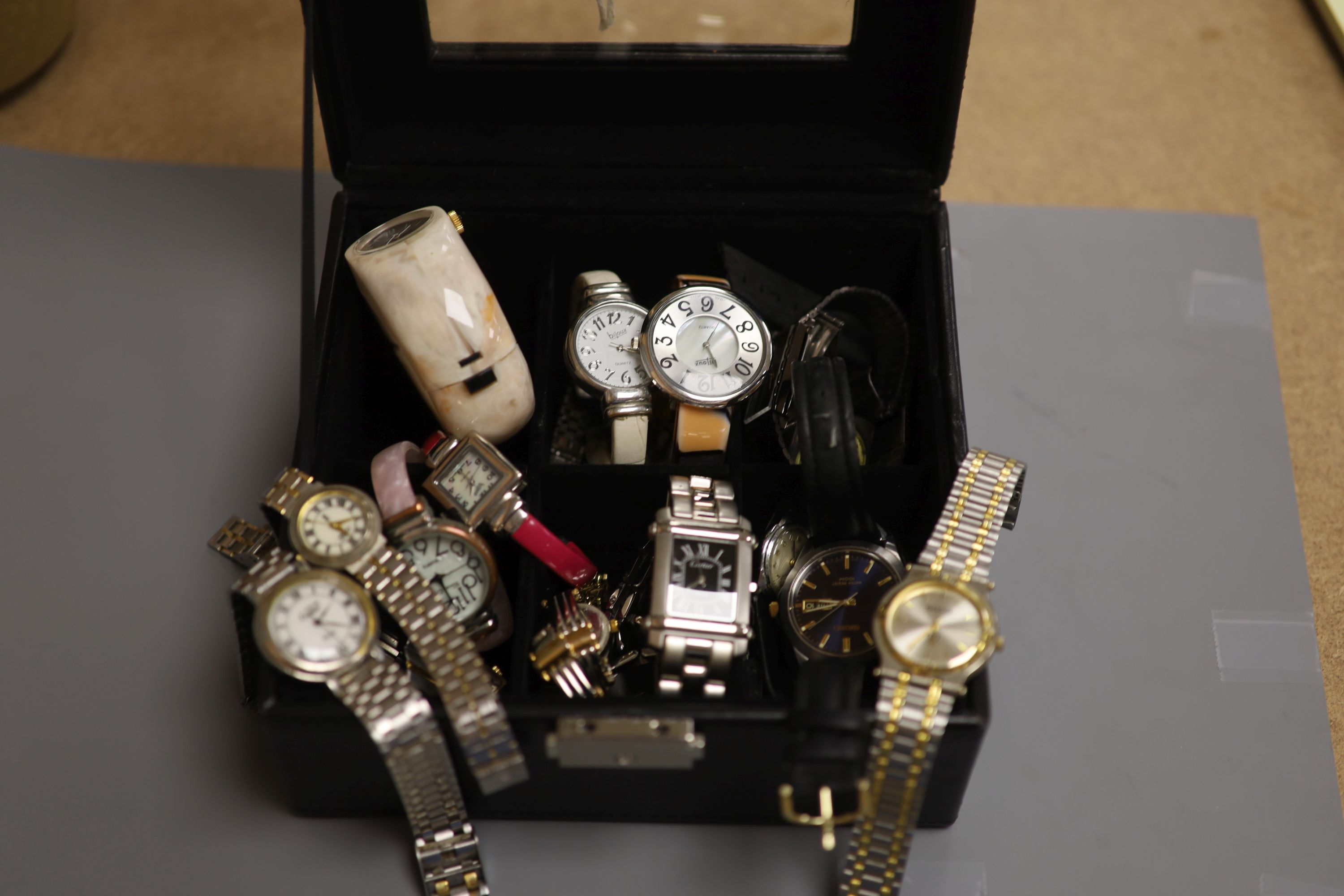 A collection of lady's and gentlemen's quartz and other wristwatches including Seiko.